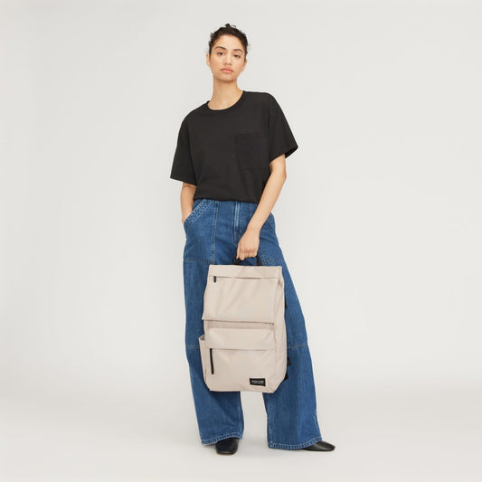 The ReNew Transit Backpack | Warm Quartz (with label)